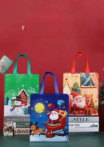 Detailed view of Christmas non-woven gift bags with Santa and Snowman prints