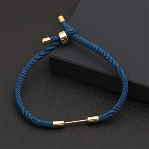 Adjustable blue braided rope bracelet with golden sliding closure on black leather