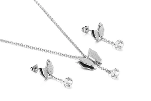 Detail of silver butterfly jewelry set with frosted wings and sparkling round zircons