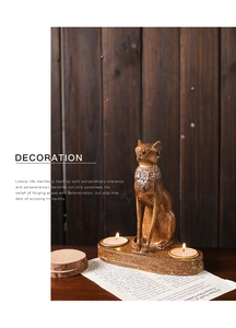 Detail of Egyptian Bastet cat candle holder with bronze finish and intricate carvings