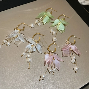 Floral acrylic petal earrings with pearls and gold accents in pink white and green