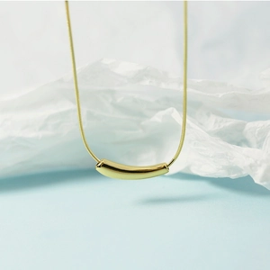 Elegant gold minimalist curved bar necklace with delicate snake chain for women