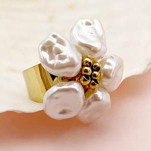 Macro shot of gold plated flower ring featuring baroque pearls and detailed gold center