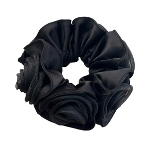 Elegant black satin rose scrunchie with layered fabric flowers and pleated vintage design