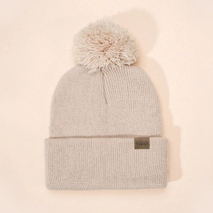 Classic cream knit beanie for kids with large pom-pom and FASHION leather patch