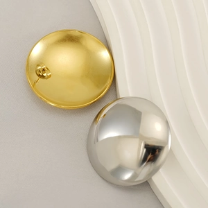 Minimalist geometric dome earrings in gold and silver finish with metallic luster