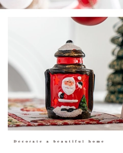 Detail view of a vintage red Santa Claus lantern decoration with 3D embossed texture