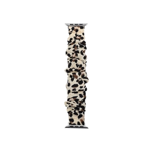 Close-up of leopard print scrunchie watch band made of elastic fabric with metal adapters