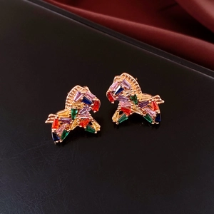 Close-up of 18K gold plated horse earrings with colorful rectangular gemstones