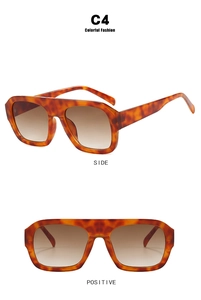 Detail view of tortoiseshell flat top square sunglasses with brown gradient lenses
