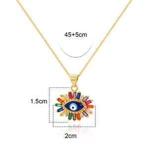 Detail of 18K gold evil eye pendant with colored zircon inlay and 45+5cm chain size