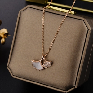 Rose gold ginkgo leaf necklace with zircon and white shell in a premium gift display