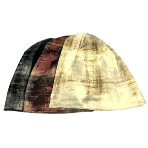 Three-piece reversible tie-dye slouchy beanies in dark green, red, and beige knit fabric