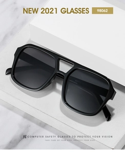 Close-up of black retro pilot computer glasses with double bridge on a white platform