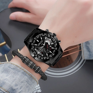 Detailed view of a black chronograph watch with date display on a wrist with guitar