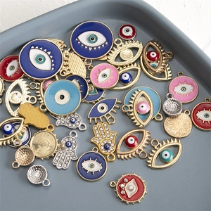 Assorted Hamsa Hand and Evil Eye charms with colorful enamel and rhinestone inlay