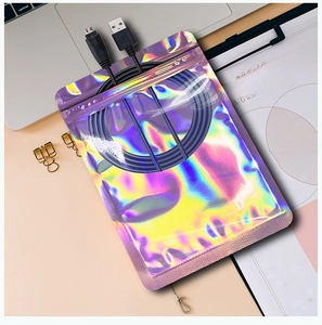 Detail of colorful laser ziplock bag containing a USB cable in a modern office setup