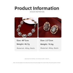 Vintage gold-tone jewelry set with grey marble resin oval links on red satin
