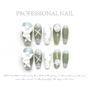 Detail of 3D embossed angel and white rose on green and white handmade press-on nails