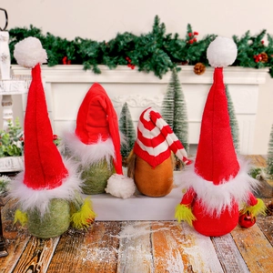 Set of four Christmas gnomes with red hats and green beards on a snowy fireplace background
