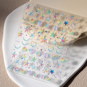 Close-up of 5D relief summer ocean nail stickers with gradient starfish and seashells