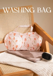 Detail of tulip mesh laundry bag for bras featuring thick fabric and convenient handle