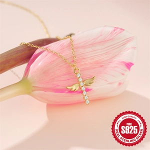 Elegant S925 sterling silver gold cross necklace with angel wings on a tulip flower