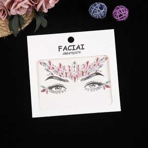 Detailed view of pink acrylic facial rhinestones for festival makeup on card