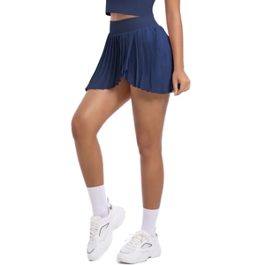 Detailed view of navy blue pleated tennis skirt with high waist and functional side pocket