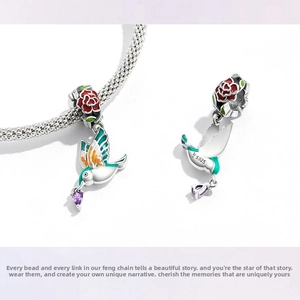 Detailed view of S925 sterling silver hummingbird charm with purple gemstone and enamel