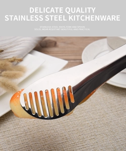 Close-up of stainless steel food tongs picking up bread in a kitchen setting