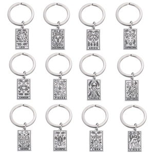Set of 12 silver stainless steel zodiac sign keychains displayed on a white background