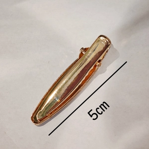 Golden 5cm metal duckbill hair clip with mirror finish and wave-shaped side grip