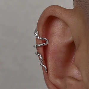 Detailed macro of the textured snake ear cuff showing fine scales in a silver finish