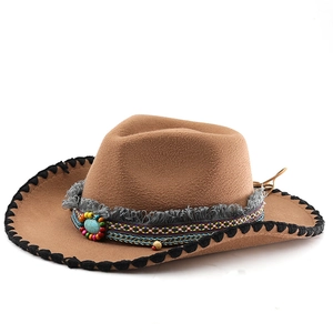 Brown wool felt western cowboy hat with ethnic tassel trim and turquoise stone accent
