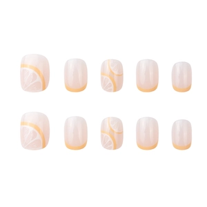 Lemon yellow French style press-on nails with translucent nude base and citrus design