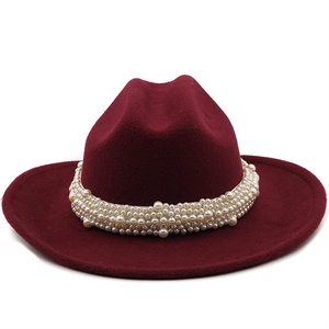 Detail view of burgundy wool fedora hat featuring multi-layered pearl band embellishment
