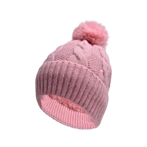 Detail view of pink cable knit beanie featuring fluffy pompom and thick fleece lining