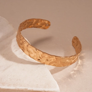Minimalist hammered texture gold cuff bracelet featuring vintage geometric design