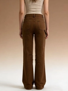 Detail view of brown cargo pants showing back pockets and side hammer loop design