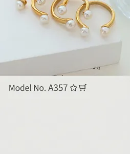 Matte gold open ring featuring two elegant white pearls at each end in a modern style