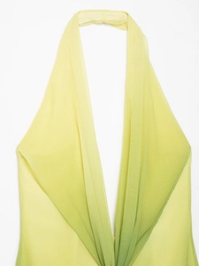 Detail of gradient halter neck top showing yellow to turquoise transition and chiffon fabric