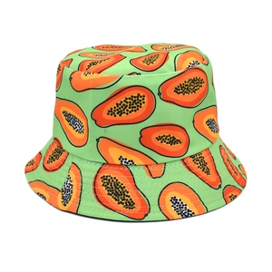 Detailed macro view of the vivid papaya print on green fabric bucket hat crown