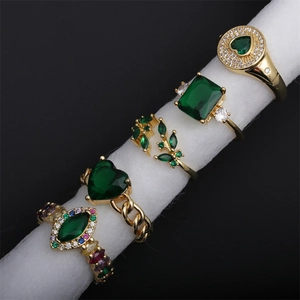Adjustable gold plated ring set with green cubic zirconia in various geometric heart shapes