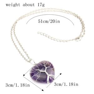 Macro shot of silver wire-wrapped life tree heart pendant with dimension measurements