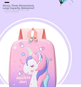 Close-up of waterproof pink unicorn school bag showing magical time print and silver zippers