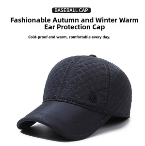 Detail view of navy blue quilted baseball cap with warm fold-down ear flaps for winter
