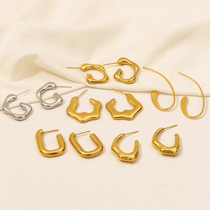 Detailed flat lay of assorted 18K gold and silver plated geometric stainless steel earrings