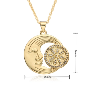 Detail view of gold sun and moon pendant dimensions measuring 24mm by 25mm with cubic zirconia