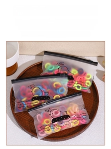 Elastic colorful hair ties in frosted zipper pouch with cute duckling graphics